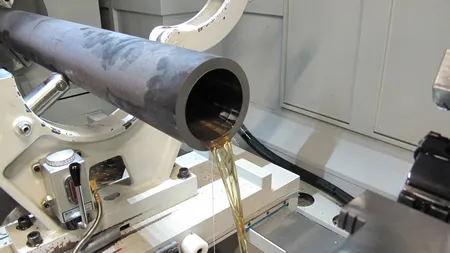 Deep-hole drilling machine boring a long steel workpiece
